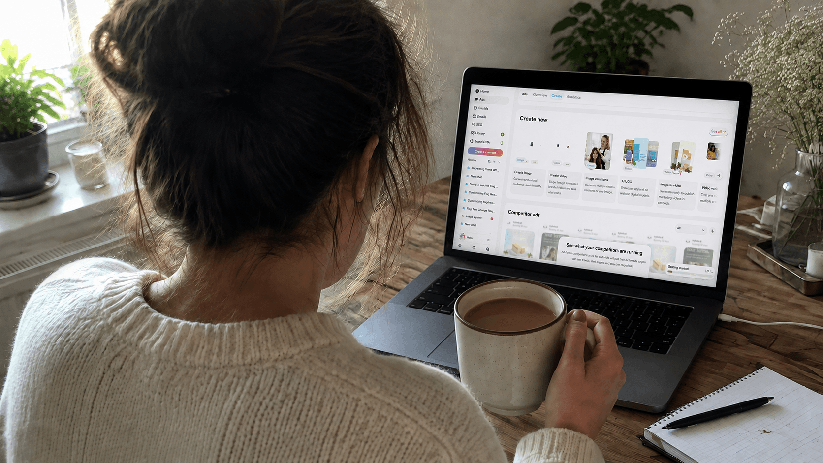 Bakery owner reviewing the Holo dashboard on a laptop with a cup of coffee.